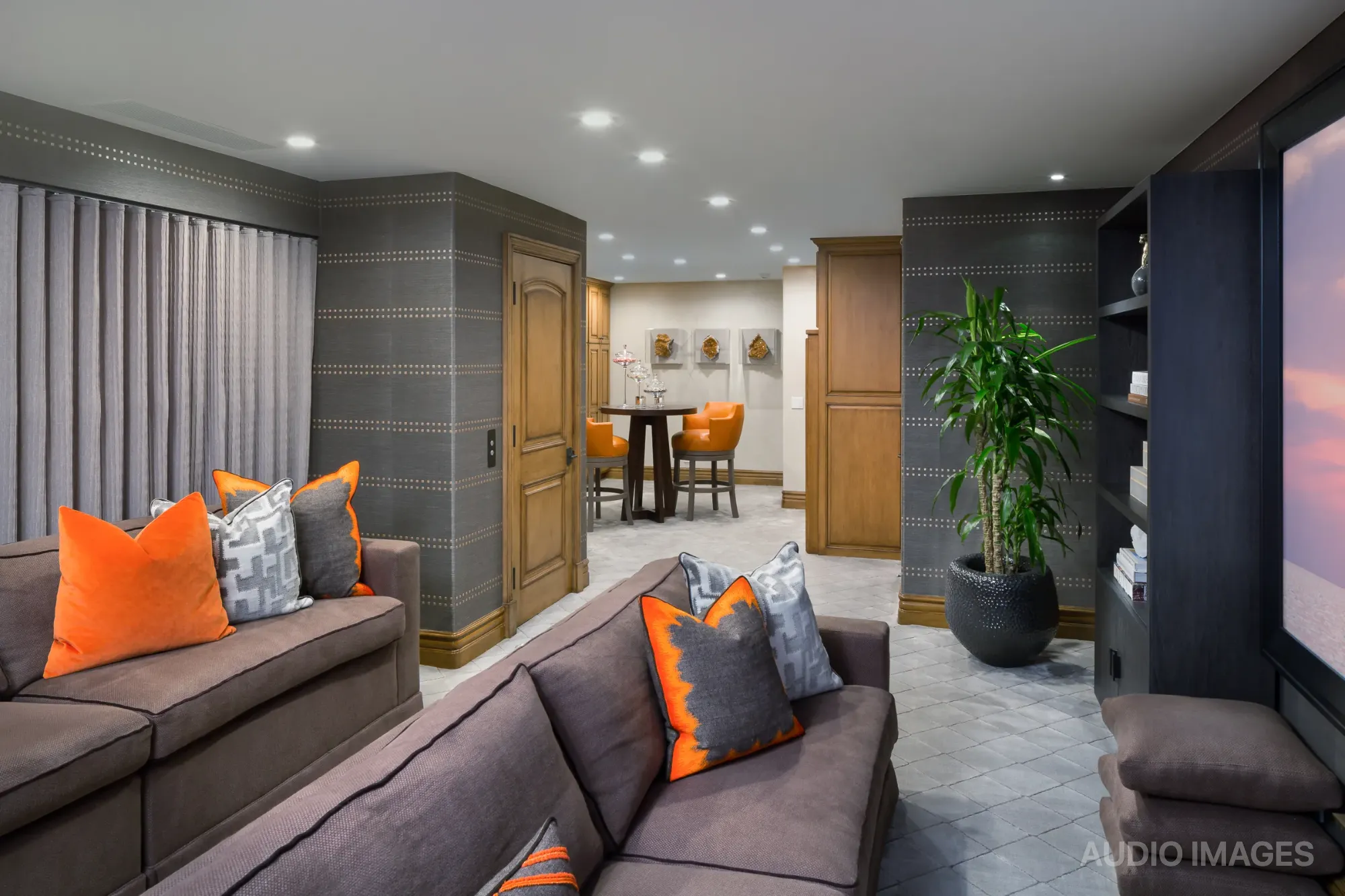 The media room from the rear, with the bar area visible in the background.
