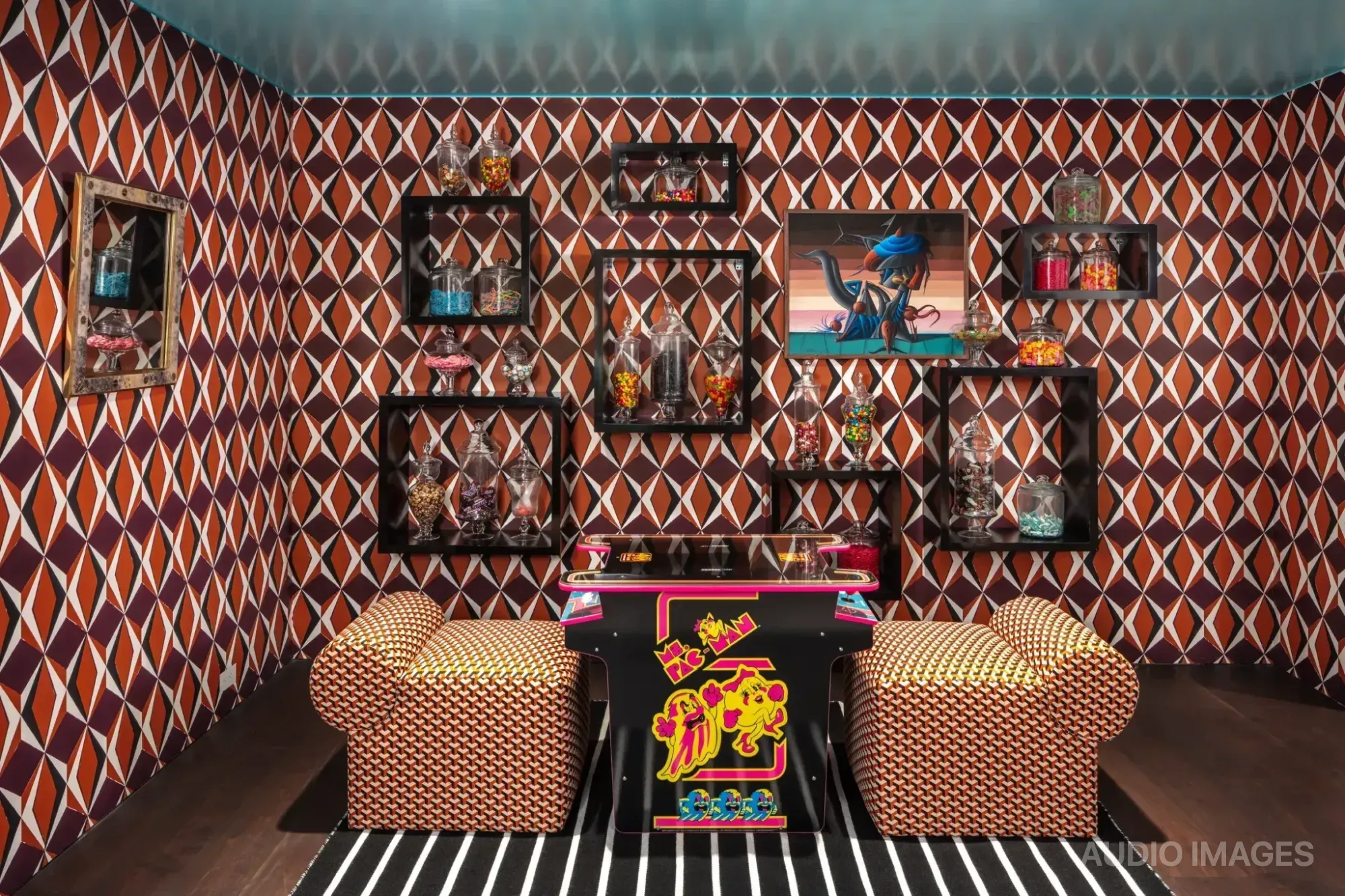 Eagle’s Nest — Ms. Pac-Man cabinet doubling as a candy station in the pre-show concession area.