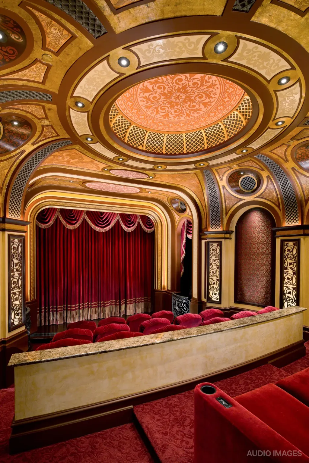 Cinema Paradiso — domed auditorium with red curtained stage and gilded proscenium.
