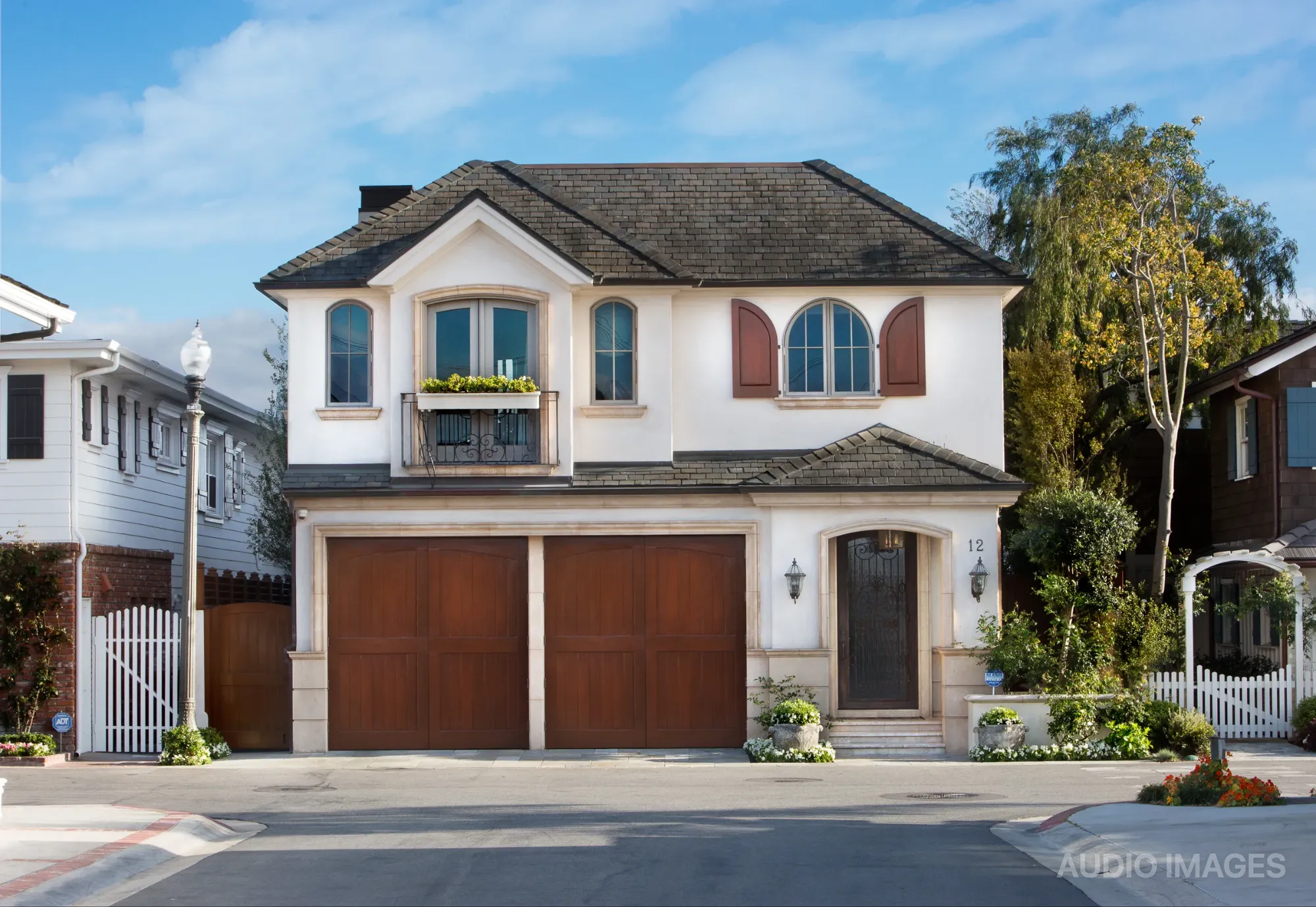 The Newport Beach residence from the street with the rooftop television fully retracted and out of sight.