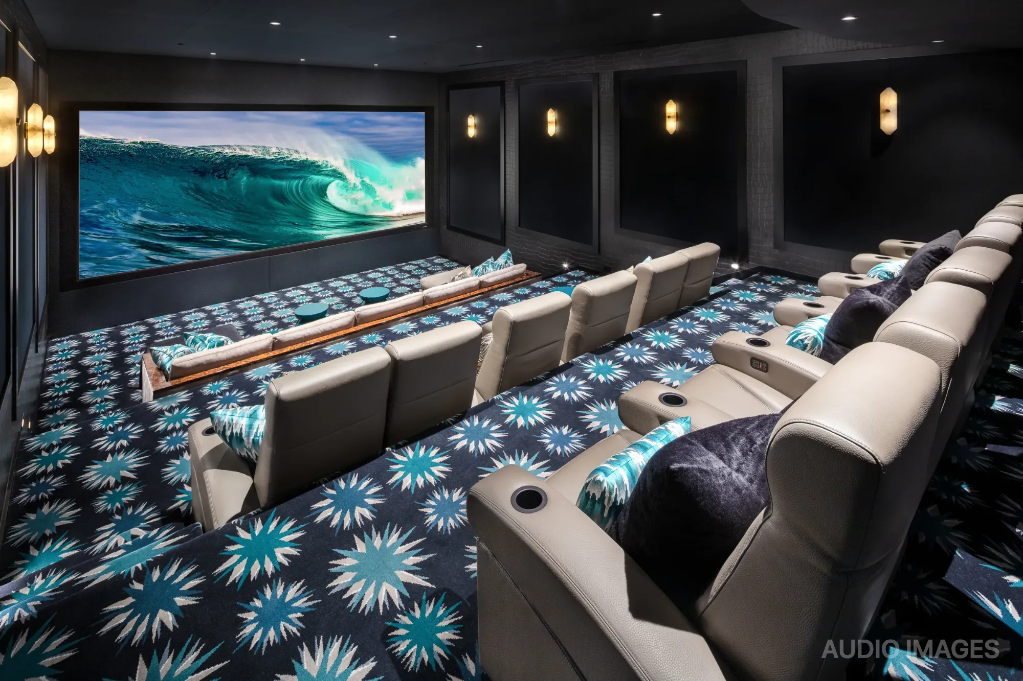 Eagle’s Nest — panoramic 210-inch masking screen glowing at the front of the auditorium.