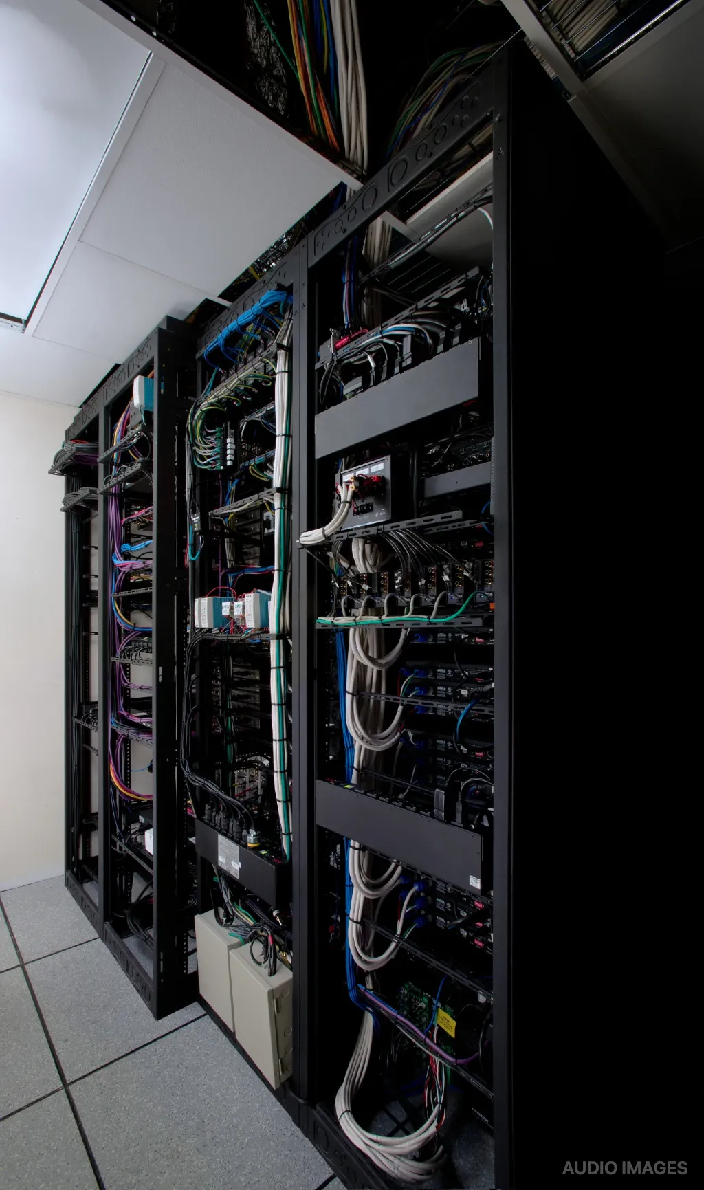 Backstage server racks with organized cabling.