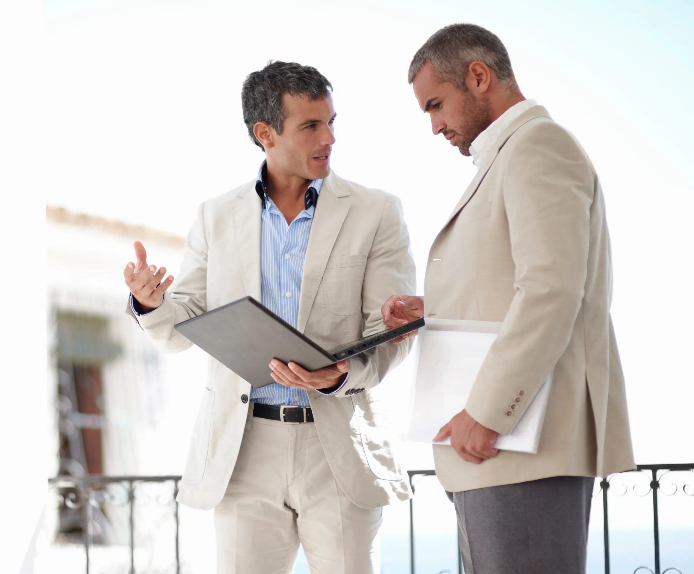 A real estate agent handing keys to a new homeowner